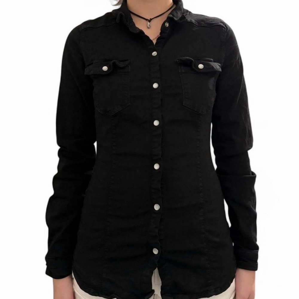 Black button-up shirt with pearl buttons and front pockets